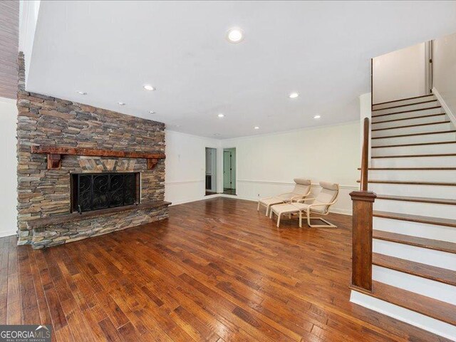5761 Kentucky Downs Dr, Macon, GA 31210 - living room with stairway, wood-type flooring, recessed lighting, and a stone fireplace