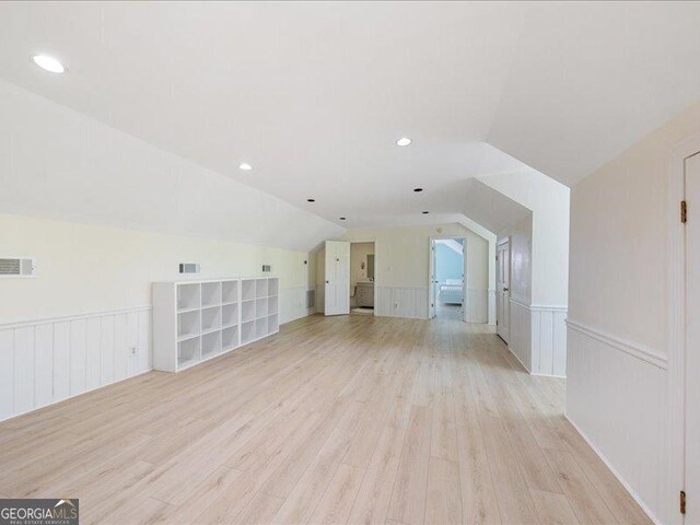5761 Kentucky Downs Dr, Macon, GA 31210 - additional living space with lofted ceiling, light wood-style flooring, wainscoting, and recessed lighting