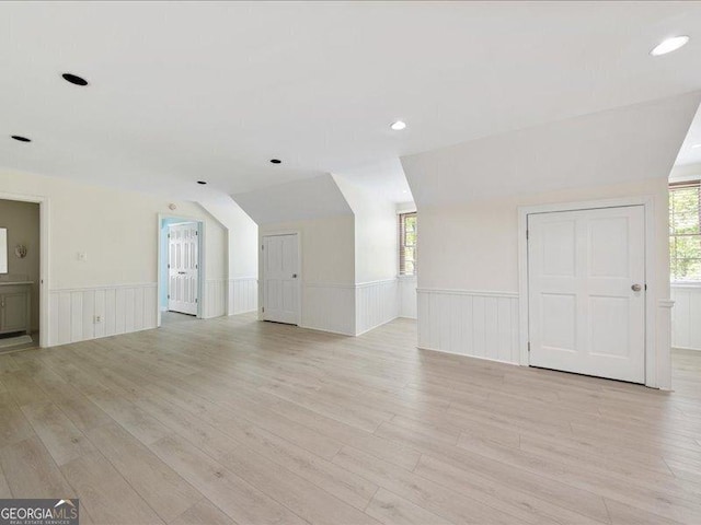 5761 Kentucky Downs Dr, Macon, GA 31210 - unfurnished living room featuring a wainscoted wall, plenty of natural light, light wood-type flooring, recessed lighting, and a decorative wall