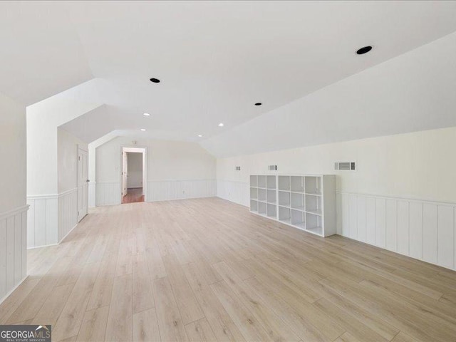 5761 Kentucky Downs Dr, Macon, GA 31210 - bonus room with lofted ceiling, light wood finished floors, a wainscoted wall, and a decorative wall