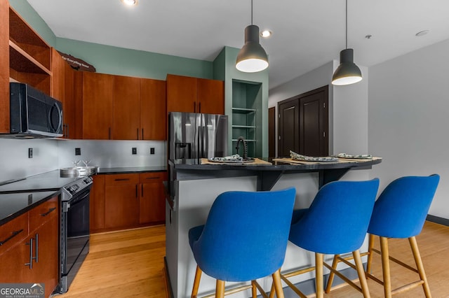 747 Ralph Mcgill Blvd NE Unit 223, Atlanta, GA 30312 - kitchen featuring black microwave, electric range oven, light wood-style flooring, stainless steel refrigerator with ice dispenser, and open shelves