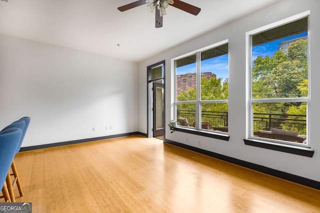 747 Ralph Mcgill Blvd NE Unit 223, Atlanta, GA 30312 - spare room featuring ceiling fan, wood finished floors, and baseboards