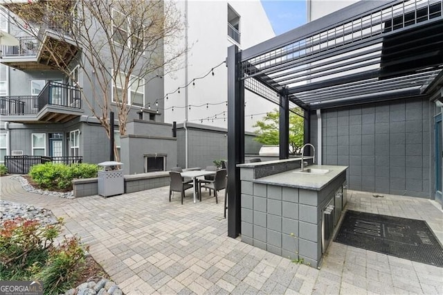 747 Ralph Mcgill Blvd NE Unit 223, Atlanta, GA 30312 - view of patio / terrace with an outdoor kitchen, a pergola, and outdoor dining area