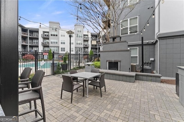 747 Ralph Mcgill Blvd NE Unit 223, Atlanta, GA 30312 - view of patio featuring an outdoor fireplace and outdoor dining space