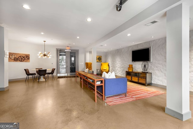 747 Ralph Mcgill Blvd NE Unit 223, Atlanta, GA 30312 - living room featuring finished concrete flooring, baseboards, recessed lighting, and a chandelier
