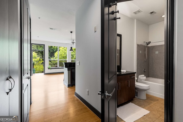 747 Ralph Mcgill Blvd NE Unit 223, Atlanta, GA 30312 - full bathroom with toilet, shower / bath combination, vanity, and a ceiling fan