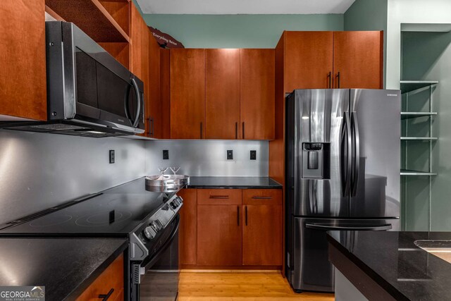 747 Ralph Mcgill Blvd NE Unit 223, Atlanta, GA 30312 - kitchen with fridge with ice dispenser, black / electric stove, light wood-style floors, open shelves, and dark stone counters