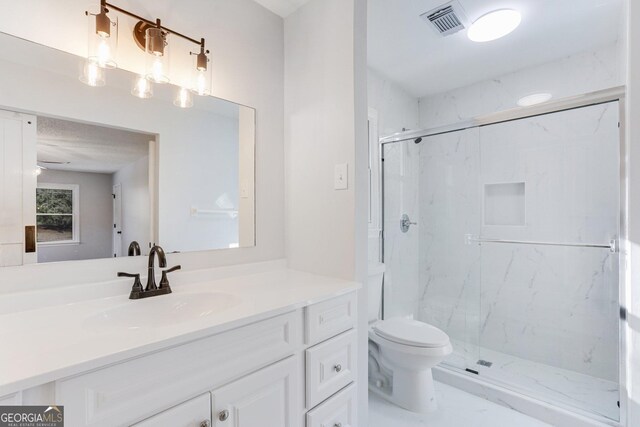 5465 N Fork Dr SW, Lilburn, GA 30047 - full bath with vanity, toilet, a marble finish shower, visible vents, and marble finish floor
