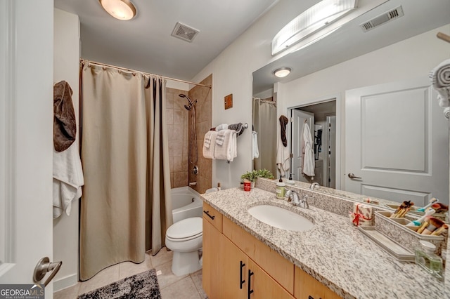 full bathroom featuring tile patterned floors, vanity, visible vents, and toilet