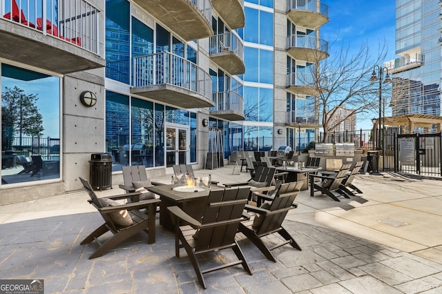 view of patio with an outdoor fire pit