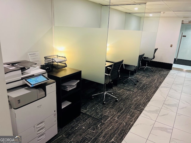 office featuring recessed lighting, marble finish floor, and a drop ceiling