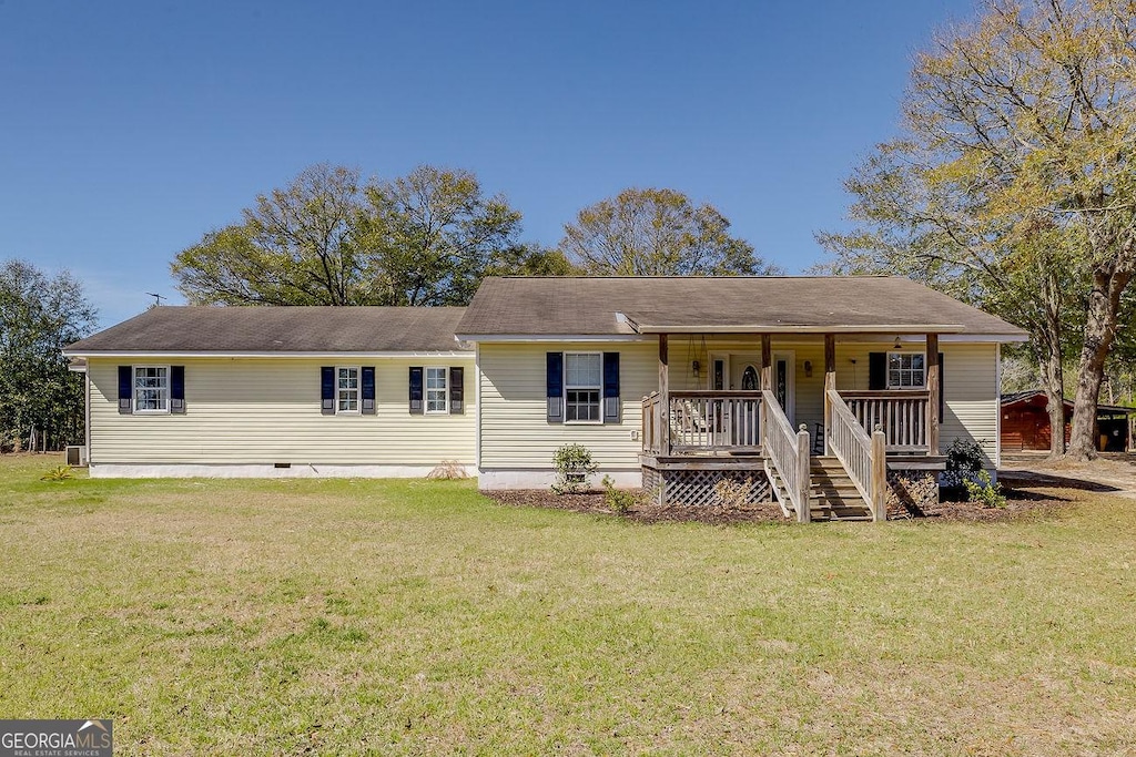 ranch-style home with a front yard, crawl space, and covered porch