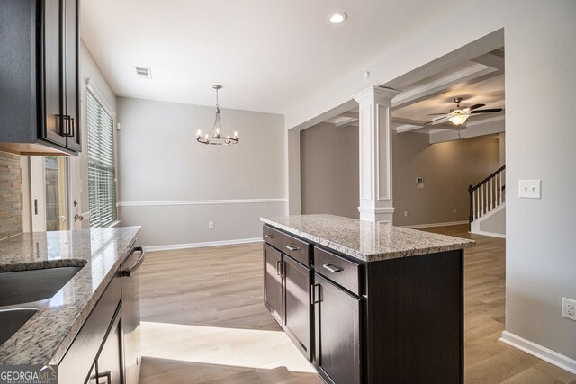 bathroom with visible vents, a sink, a shower stall, double vanity, and a garden tub