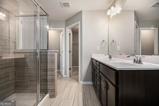 walk in closet with light carpet