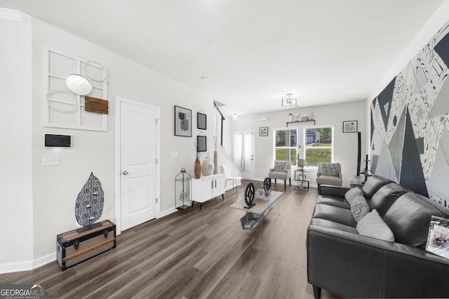living room featuring dark wood finished floors and baseboards