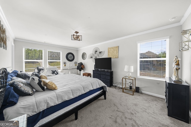 carpeted bedroom featuring baseboards, ornamental molding, and multiple windows
