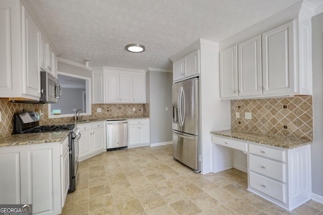 72 Grayson New Hope Rd, Grayson, GA 30017 - kitchen featuring stainless steel appliances, white cabinetry, and backsplash