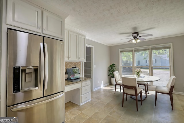 72 Grayson New Hope Rd, Grayson, GA 30017 - kitchen featuring stainless steel fridge with ice dispenser, tasteful backsplash, baseboards, white cabinets, and ceiling fan