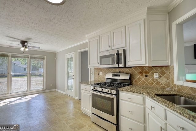72 Grayson New Hope Rd, Grayson, GA 30017 - kitchen with a textured ceiling, appliances with stainless steel finishes, stone counters, and backsplash