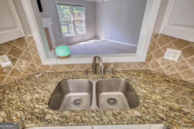 72 Grayson New Hope Rd, Grayson, GA 30017 - details with tasteful backsplash, stone counters, a sink, and a fireplace