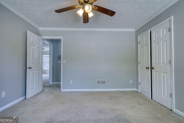 72 Grayson New Hope Rd, Grayson, GA 30017 - unfurnished bedroom with a textured ceiling, carpet flooring, and visible vents