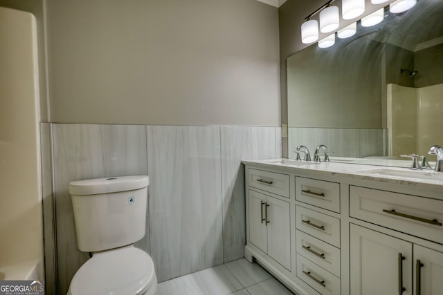 72 Grayson New Hope Rd, Grayson, GA 30017 - full bathroom featuring tile patterned floors, walk in shower, toilet, wainscoting, and a sink