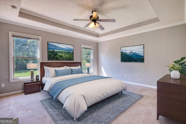 72 Grayson New Hope Rd, Grayson, GA 30017 - bedroom featuring baseboards, ornamental molding, ceiling fan, a tray ceiling, and light colored carpet