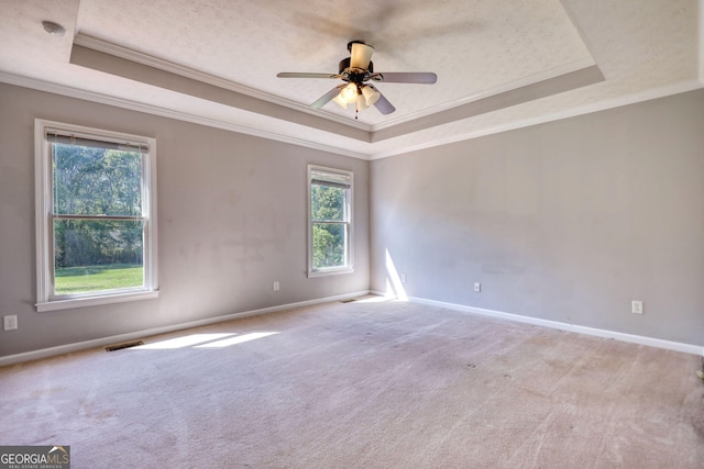 72 Grayson New Hope Rd, Grayson, GA 30017 - unfurnished room featuring a raised ceiling, crown molding, a ceiling fan, and visible vents