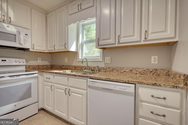 72 Grayson New Hope Rd, Grayson, GA 30017 - kitchen with a sink, white cabinets, white appliances, and light stone countertops