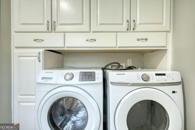 72 Grayson New Hope Rd, Grayson, GA 30017 - clothes washing area with independent washer and dryer and cabinet space