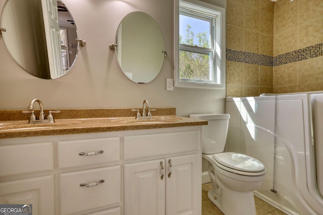 72 Grayson New Hope Rd, Grayson, GA 30017 - full bathroom featuring toilet, double vanity, a sink, and walk in shower