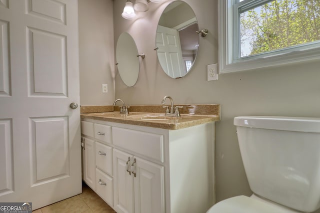 72 Grayson New Hope Rd, Grayson, GA 30017 - bathroom with toilet, tile patterned floors, and vanity