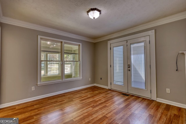 72 Grayson New Hope Rd, Grayson, GA 30017 - entryway featuring light wood-style flooring, crown molding, french doors, and baseboards