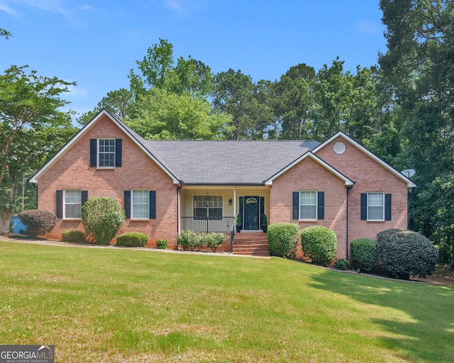 75 The Farm Rd, Mcdonough, GA 30252 - view of front of property with brick siding, a porch, a front lawn, and a shingled roof