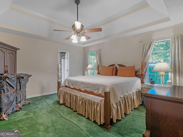 75 The Farm Rd, Mcdonough, GA 30252 - bedroom with light carpet, a raised ceiling, ornamental molding, ceiling fan, and baseboards