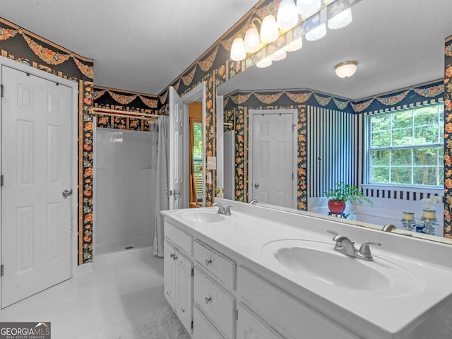 75 The Farm Rd, Mcdonough, GA 30252 - full bathroom featuring wallpapered walls, a stall shower, double vanity, and a textured ceiling
