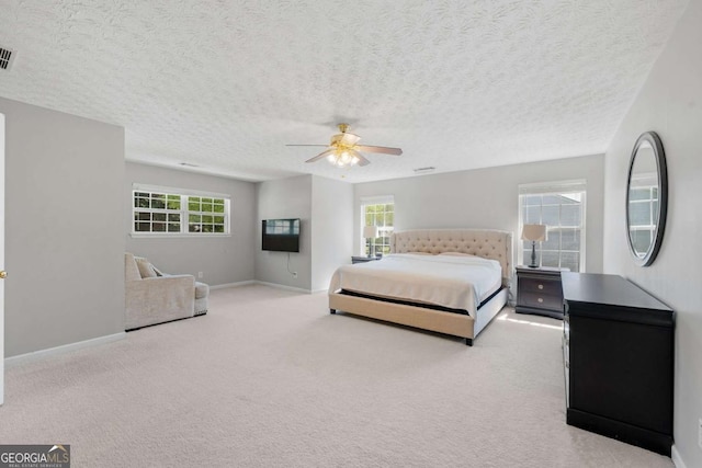bedroom with baseboards, a ceiling fan, and carpet