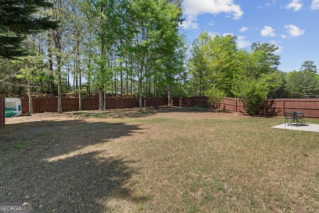 view of yard featuring a fenced backyard