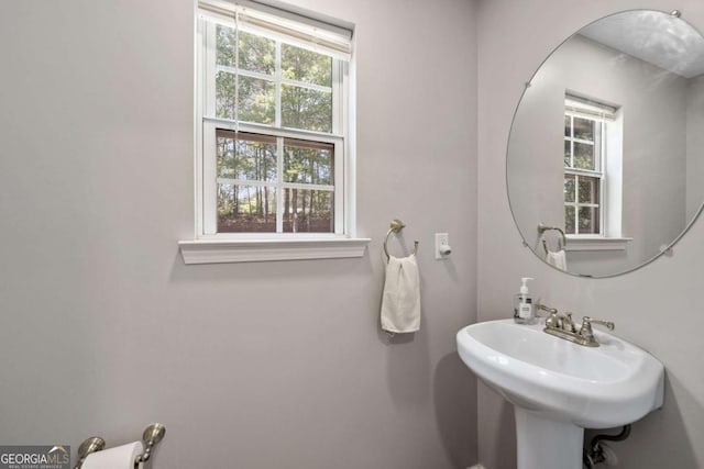 bathroom featuring a sink and plenty of natural light