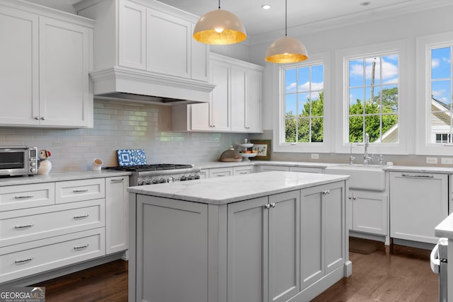 1116 Dan Johnson Rd NE, Atlanta, GA 30307 - kitchen featuring a kitchen island, dark wood finished floors, tasteful backsplash, and white cabinets