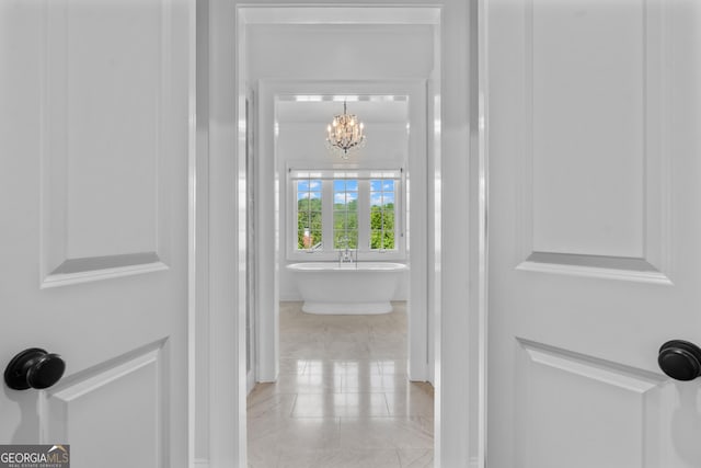 1116 Dan Johnson Rd NE, Atlanta, GA 30307 - corridor with a chandelier and tile patterned flooring