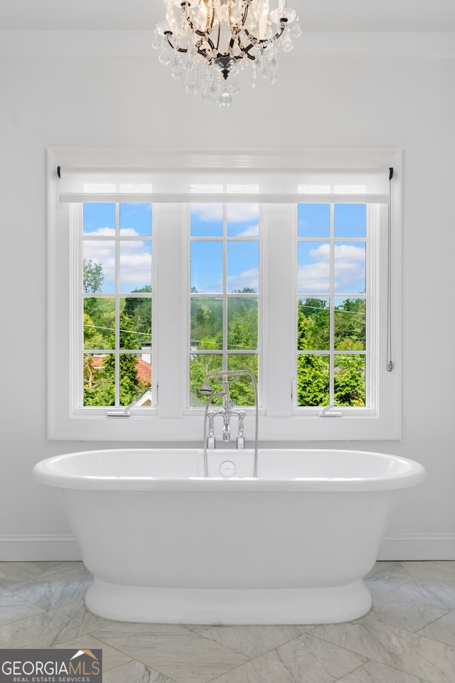 1116 Dan Johnson Rd NE, Atlanta, GA 30307 - full bath with a soaking tub, a notable chandelier, baseboards, and marble finish floor