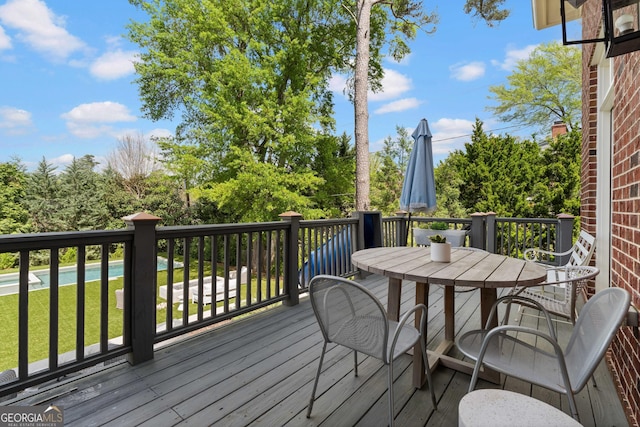 1116 Dan Johnson Rd NE, Atlanta, GA 30307 - wooden deck with outdoor dining area and an outdoor pool