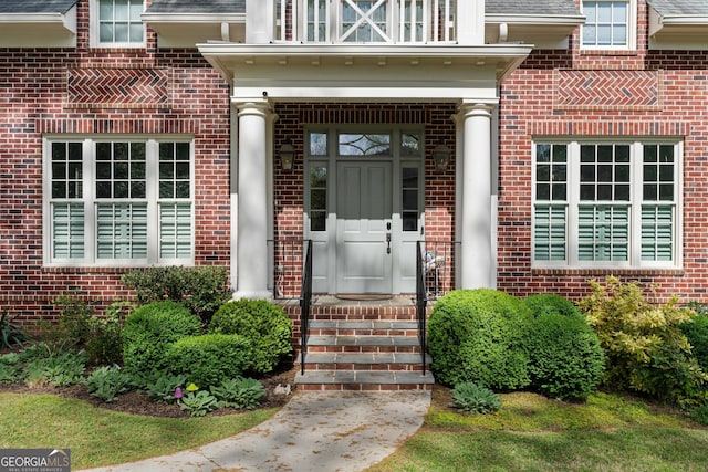 1116 Dan Johnson Rd NE, Atlanta, GA 30307 - entrance to property featuring a balcony, brick siding, and a shingled roof