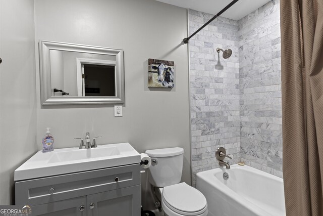 full bath featuring toilet, tub / shower combination, and vanity