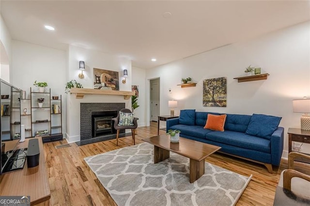 1884 Montrose Dr, East Point, GA 30344 - living room with a fireplace with flush hearth, baseboards, wood finished floors, and recessed lighting