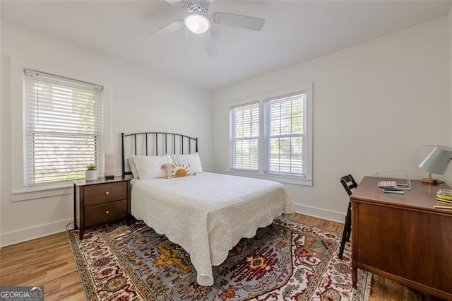 1884 Montrose Dr, East Point, GA 30344 - bedroom with wood finished floors, baseboards, and a ceiling fan