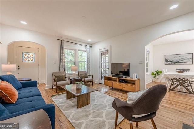 1884 Montrose Dr, East Point, GA 30344 - living area with baseboards, arched walkways, light wood-style floors, and recessed lighting