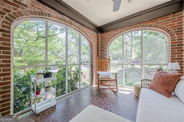 1884 Montrose Dr, East Point, GA 30344 - sunroom featuring stone flooring, a ceiling fan, and brick wall