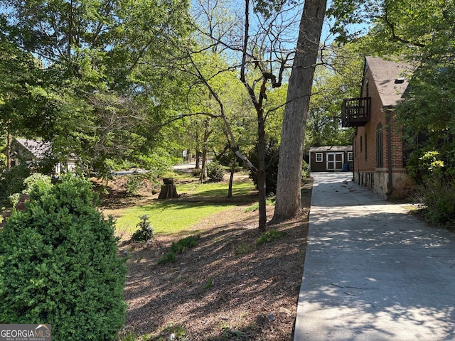 1884 Montrose Dr, East Point, GA 30344 - exterior space featuring driveway, a storage shed, an outbuilding, and a balcony